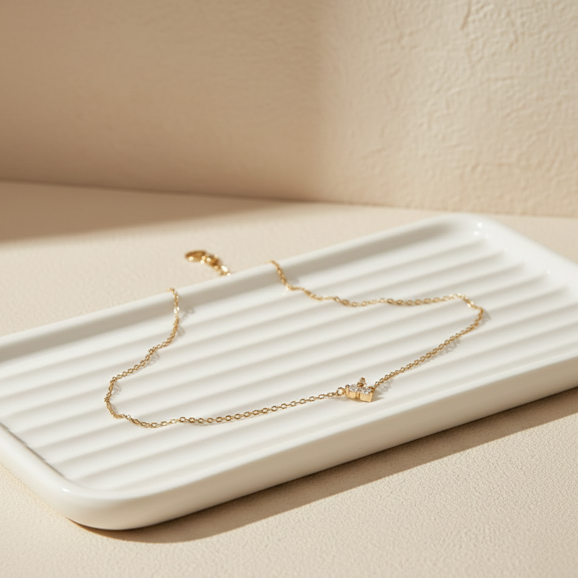Tarnish-resistant 18k gold plated everyday chain bracelet on an aesthetic neutral vanity tray.