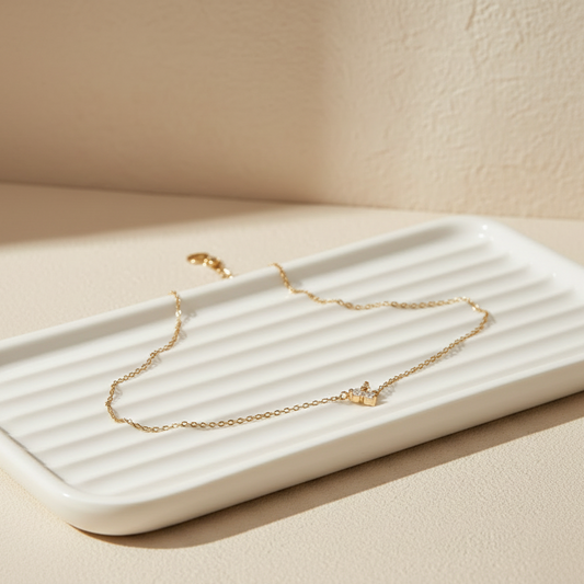 Tarnish-resistant 18k gold plated everyday chain bracelet on an aesthetic neutral vanity tray.