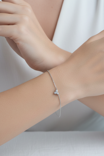 Dainty silver white gold chain bracelet with a delicate crystal cluster charm worn on a female wrist, minimal everyday silver jewelry styling by Lumire.⁠